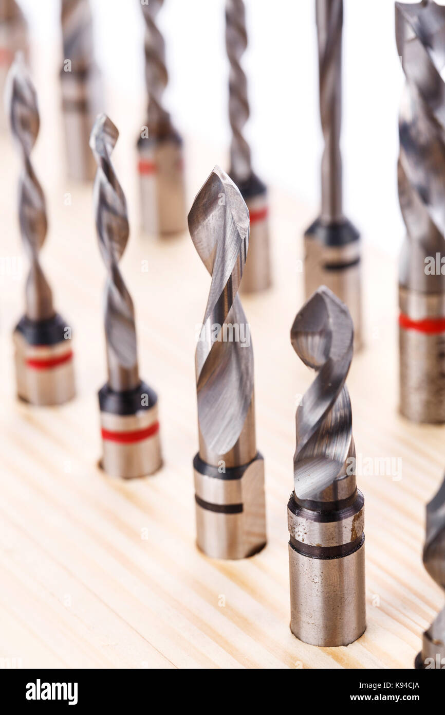 various shapes drill bits for wood on wooden stand. close-up Stock Photo