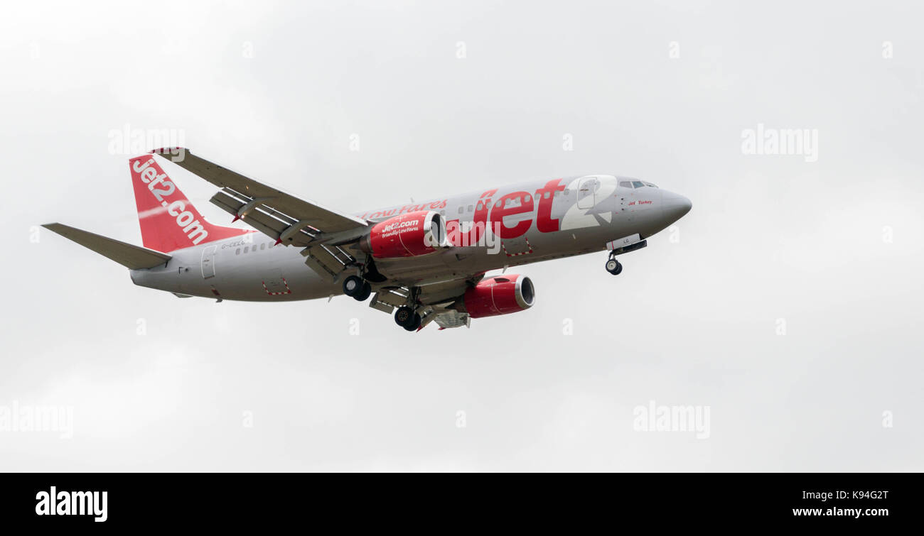 Boeing 737-377 aircraft, reg G-CELY, operated by carrier Jet2, approaches Leeds/Bradford airport for landing. Stock Photo
