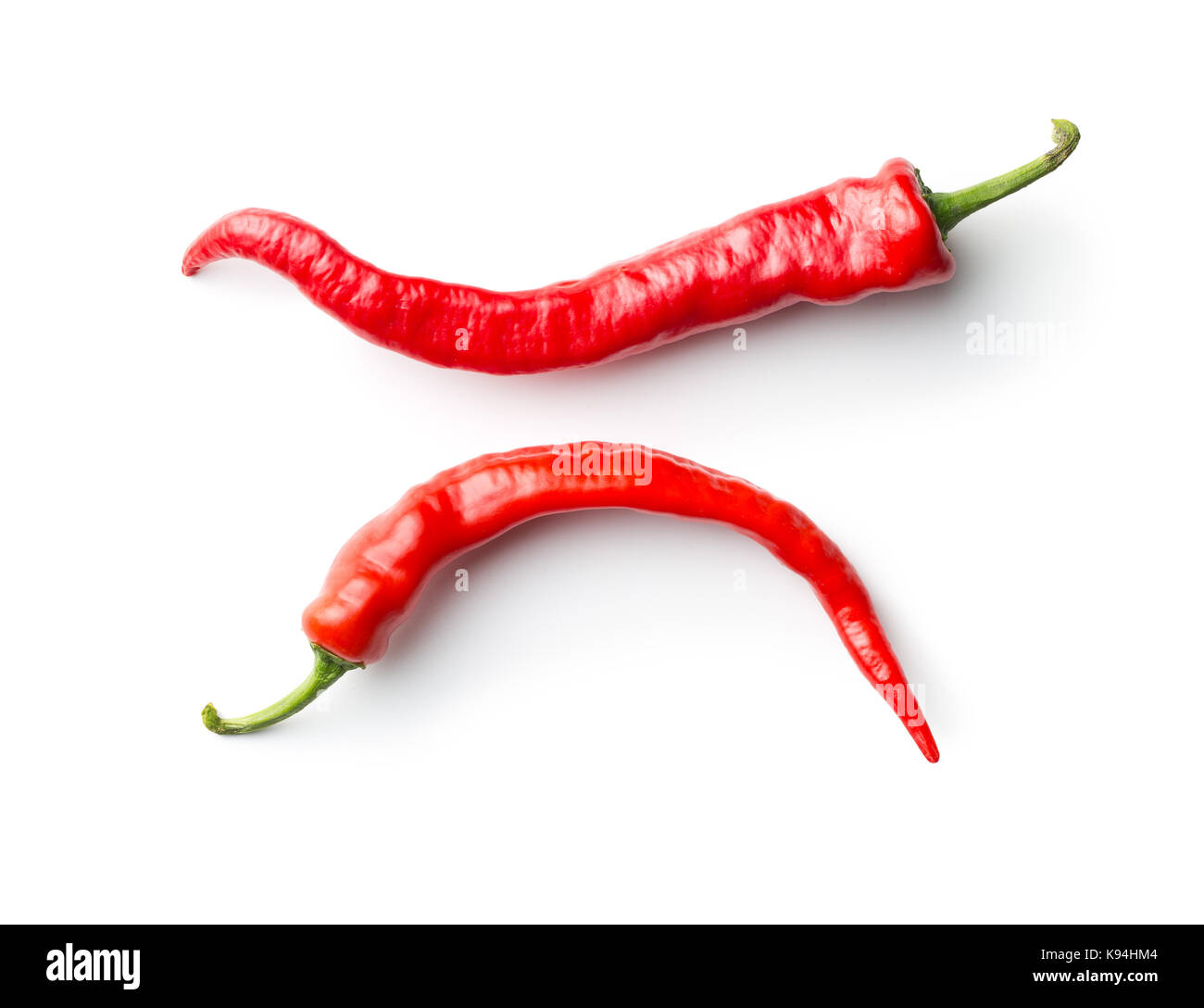 Red chili peppers isolated on white background Stock Photo - Alamy