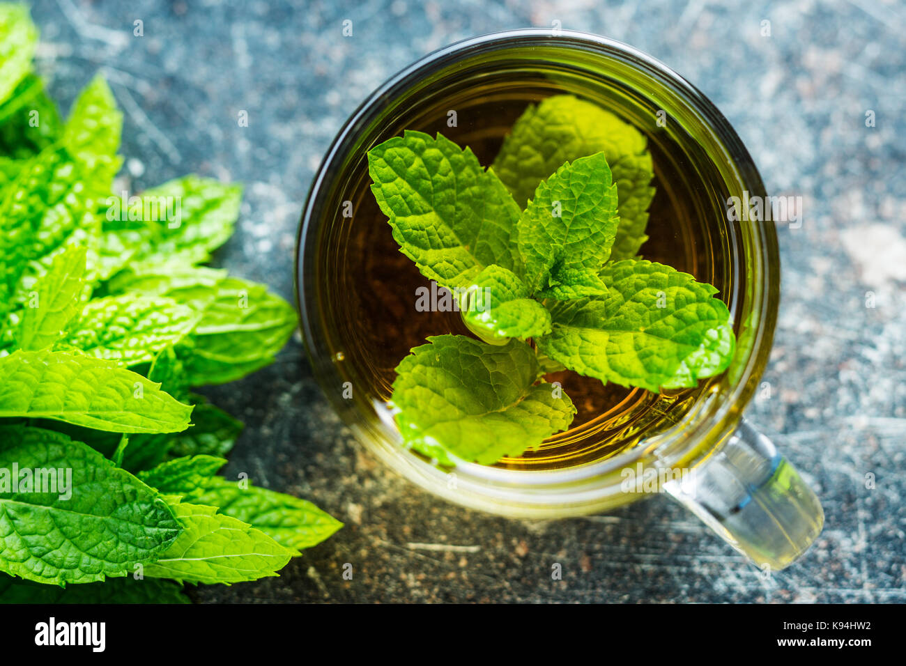 Tasty mint tea. Mint leaves and tea cup. Stock Photo