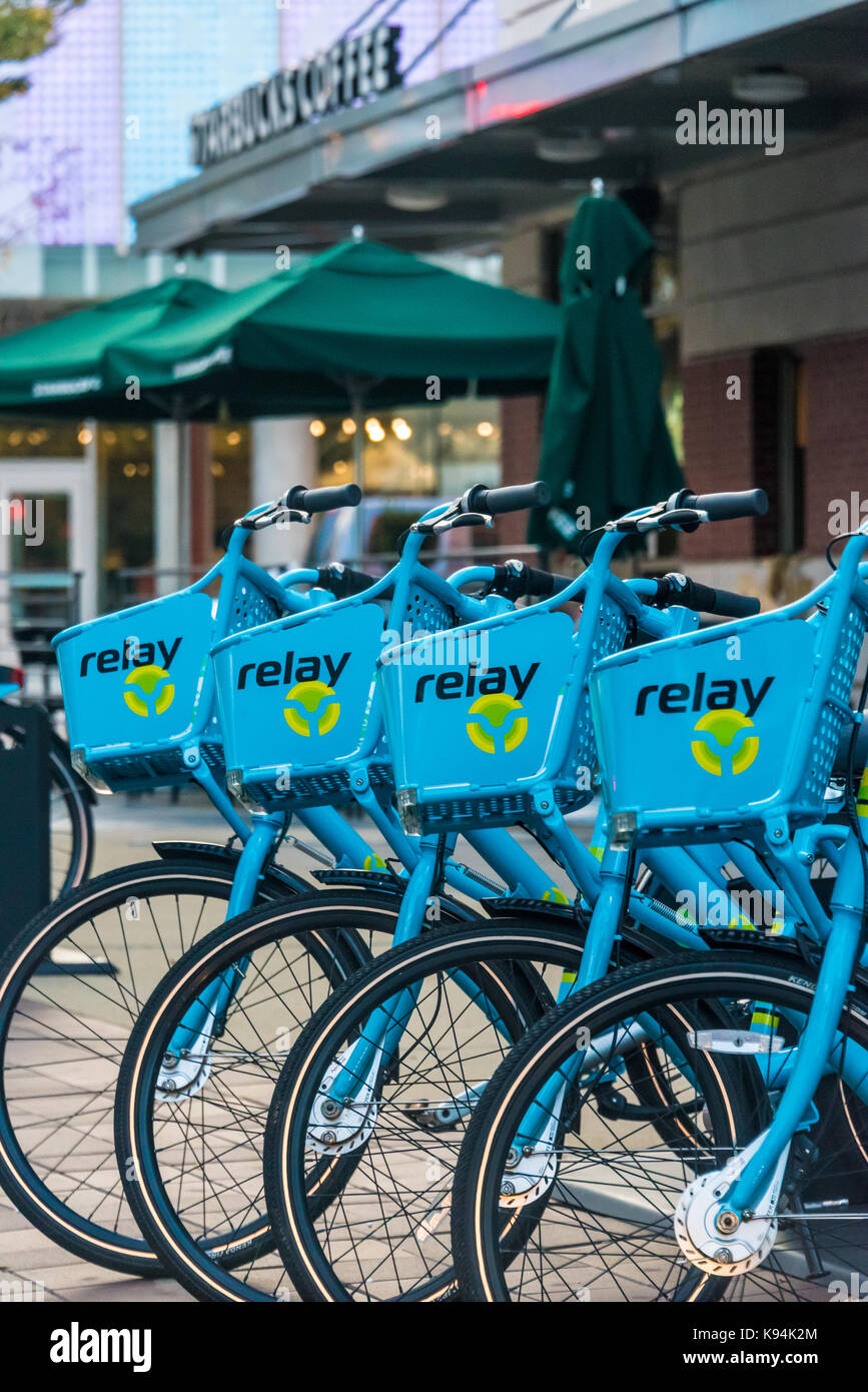Relay Bike Share self-service rental bikes at Starbucks Coffee in downtown Atlanta, Georgia next to Centennial Olympic Park. (USA) Stock Photo