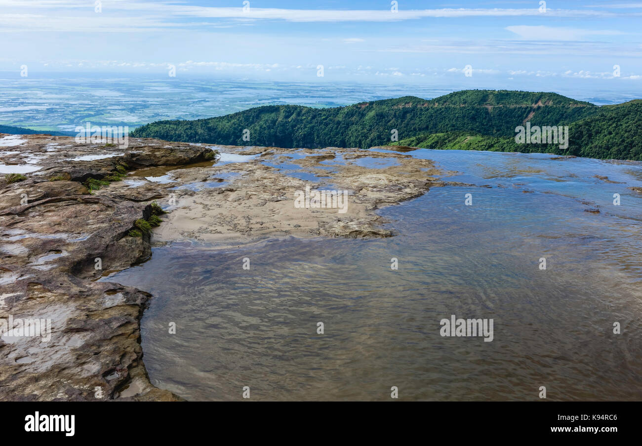 Seven Sisters waterfall at dawn with view of bedrock, Khasi hills, and in the distance flat lands of Bangladesh during monsoon in Meghalaya, India. Stock Photo