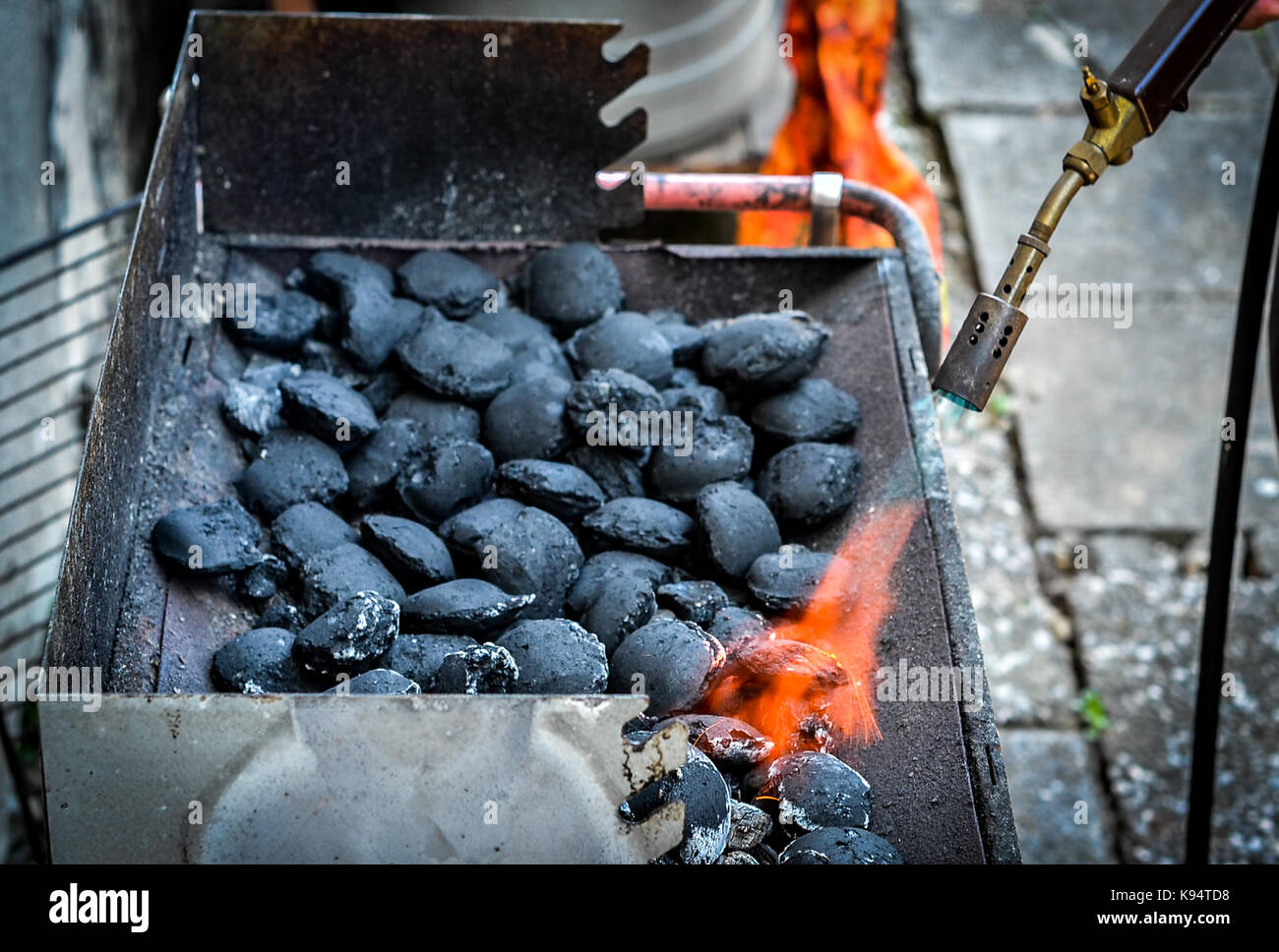respekt Snuble Stå på ski Firing up charcoal briquettes for the BBQ grill. Starting a grill with  propane gas torch Stock Photo - Alamy