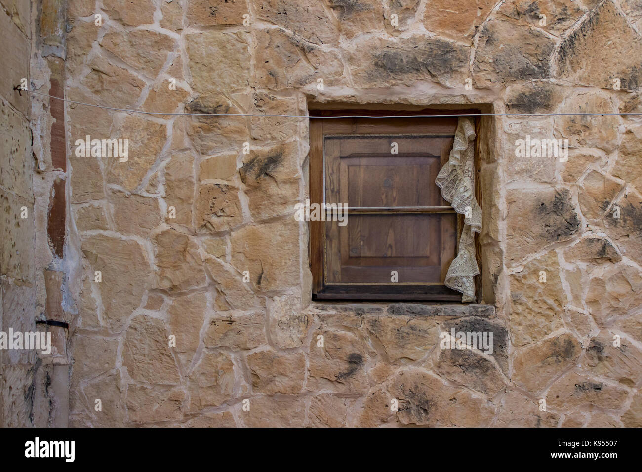 Old wooden window on stone house Stock Photo - Alamy