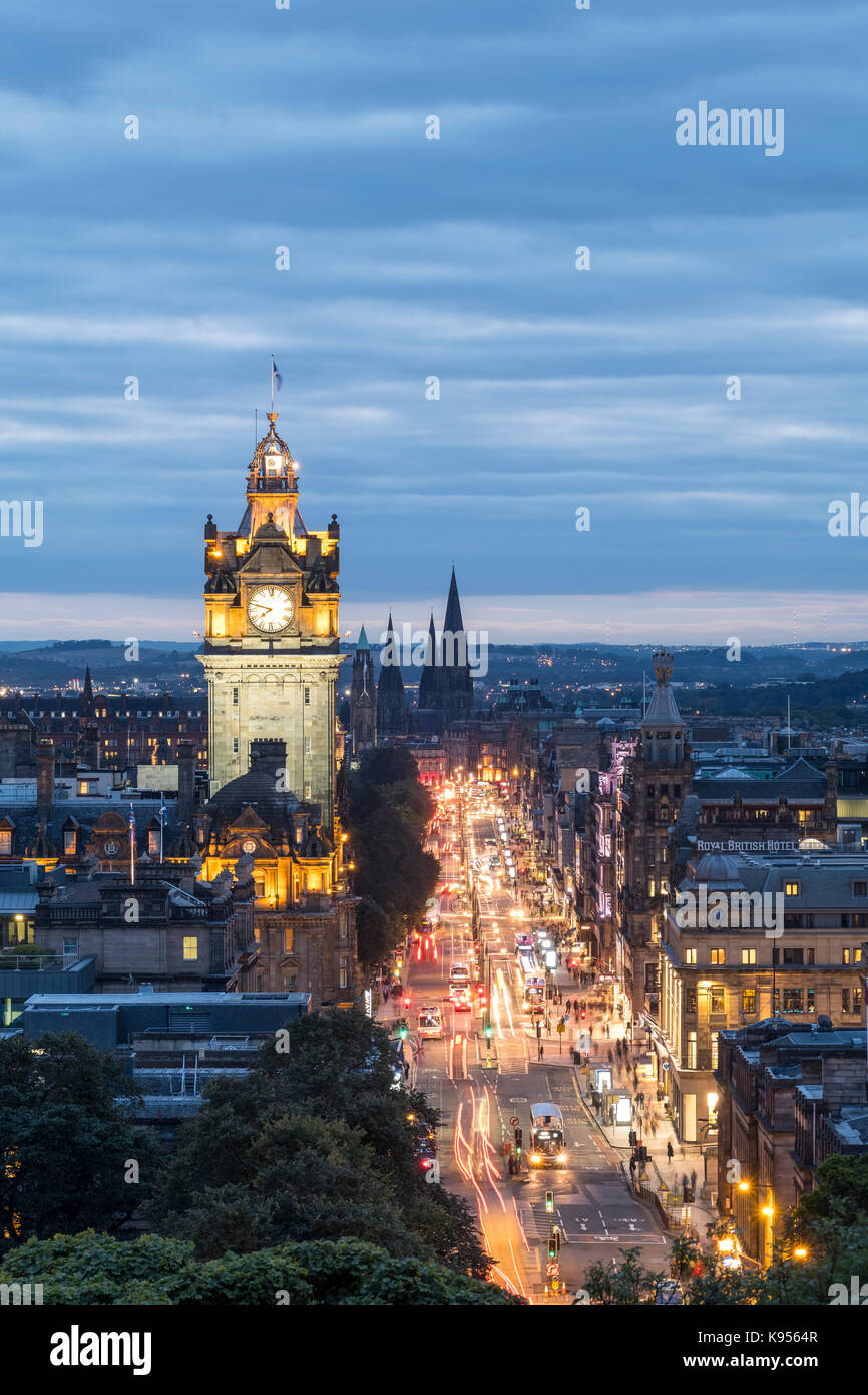 View along busy Princes Street at dusk in Edinburgh, Scotland, United Kingdom. Stock Photo