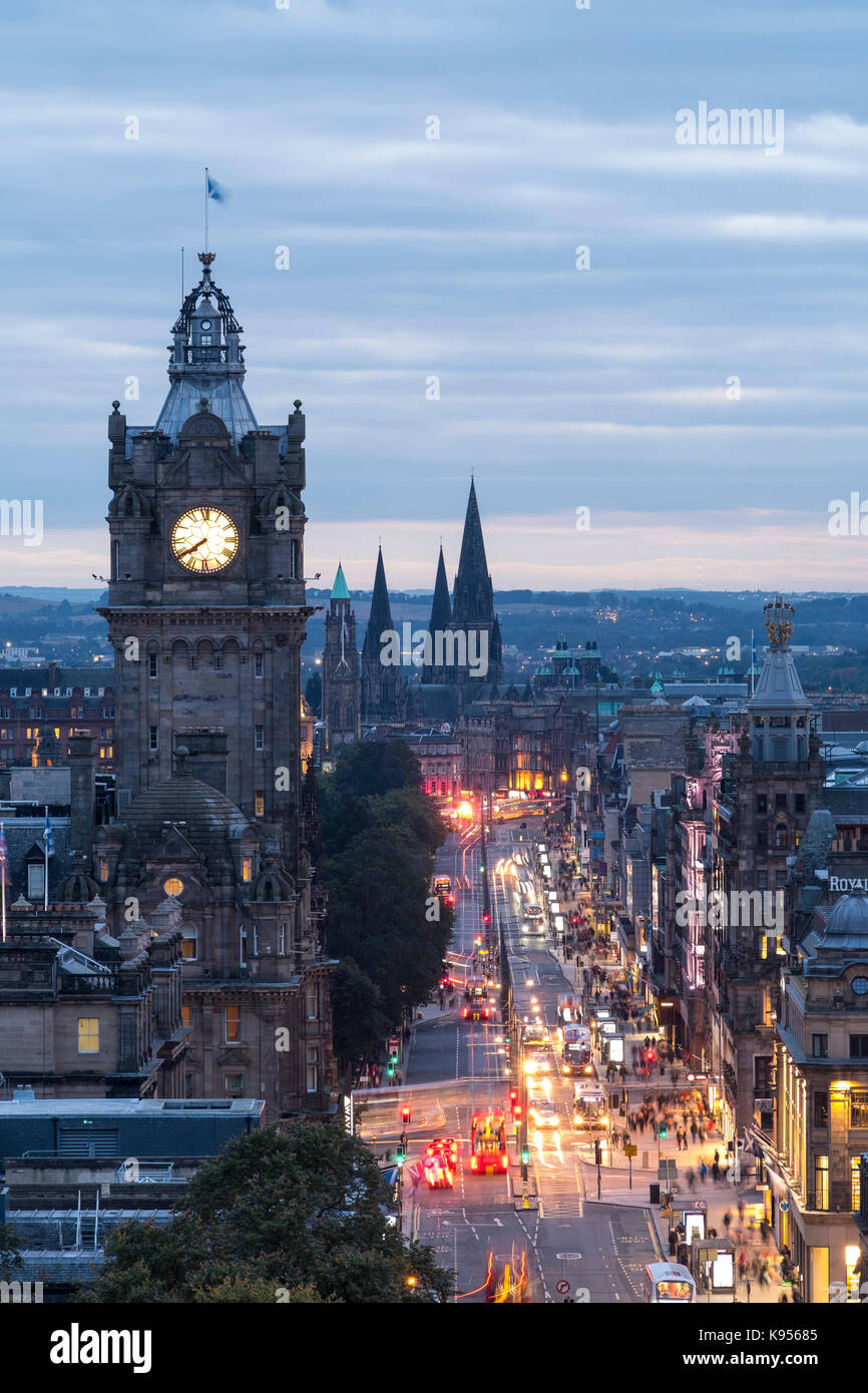 View along busy Princes Street at dusk in Edinburgh, Scotland, United Kingdom. Stock Photo