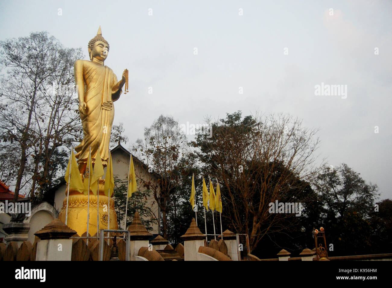Golden buddha statue of Wat Phra That Khao Noi temple for people visit ...