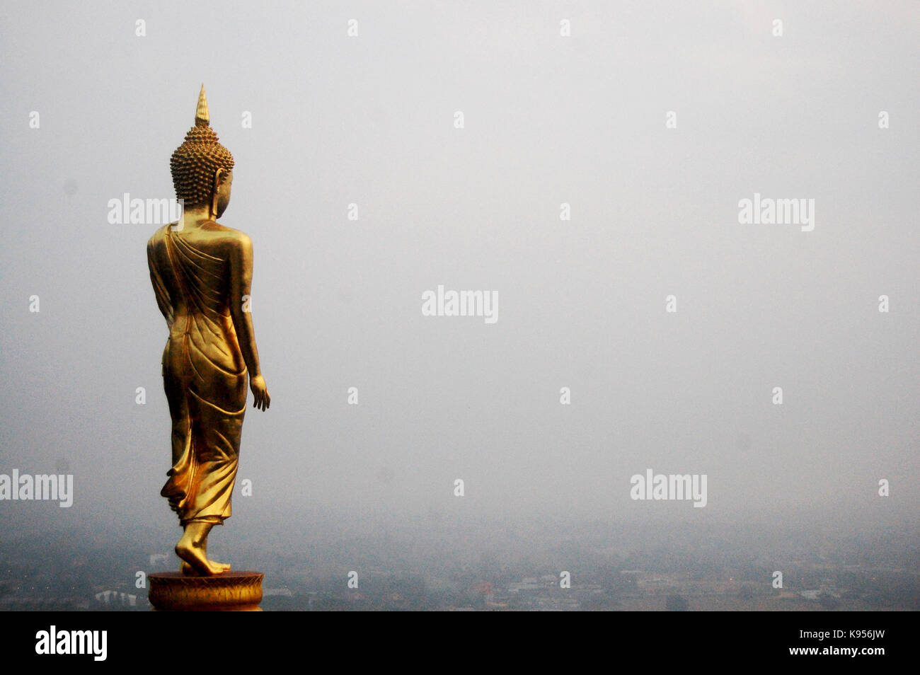 Golden buddha statue of Wat Phra That Khao Noi temple for people visit ...