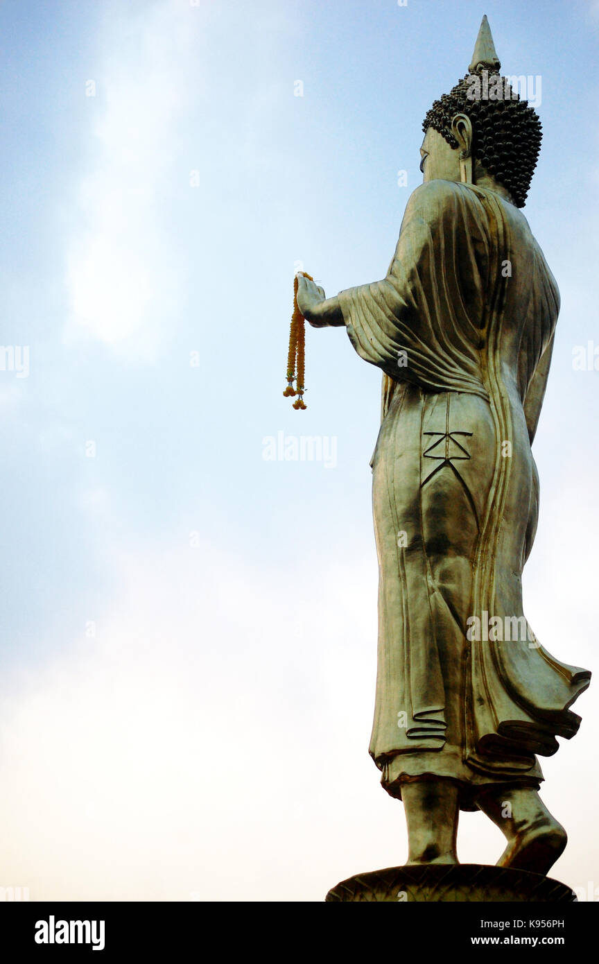 Golden buddha statue of Wat Phra That Khao Noi temple for people visit ...
