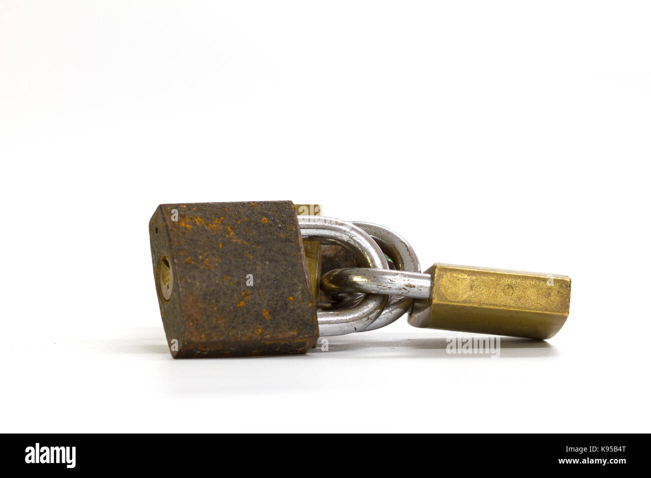 Close up on locked padlock over white background concept Stock Photo ...