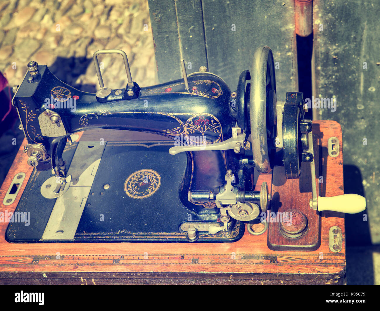 old sewing machine on wood surface out of use Stock Photo Alamy
