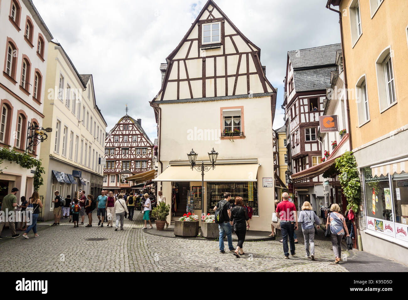 BERNKASTEL-KEUS, GERMANY - 5TH Aug 17:  Tourists stroll along Markt Street, in the middle of the old medieval town of the River Moselle. Stock Photo