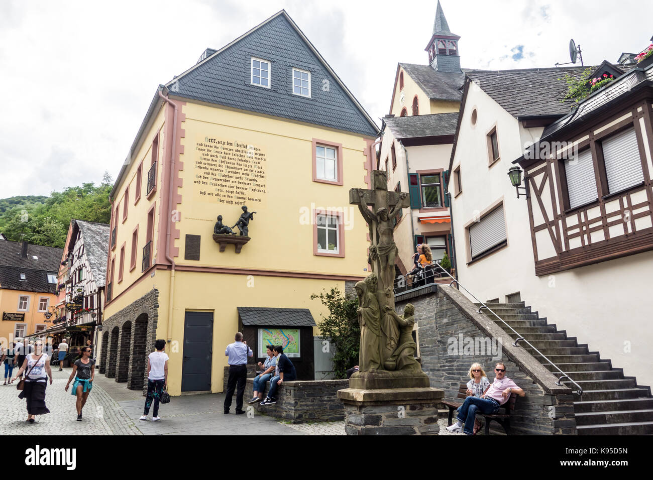 BERNKASTEL-KEUS, GERMANY - 5TH Aug 17:  Tourists stroll along a traditional cobble street, in the middle of the old medieval town of the River Moselle Stock Photo