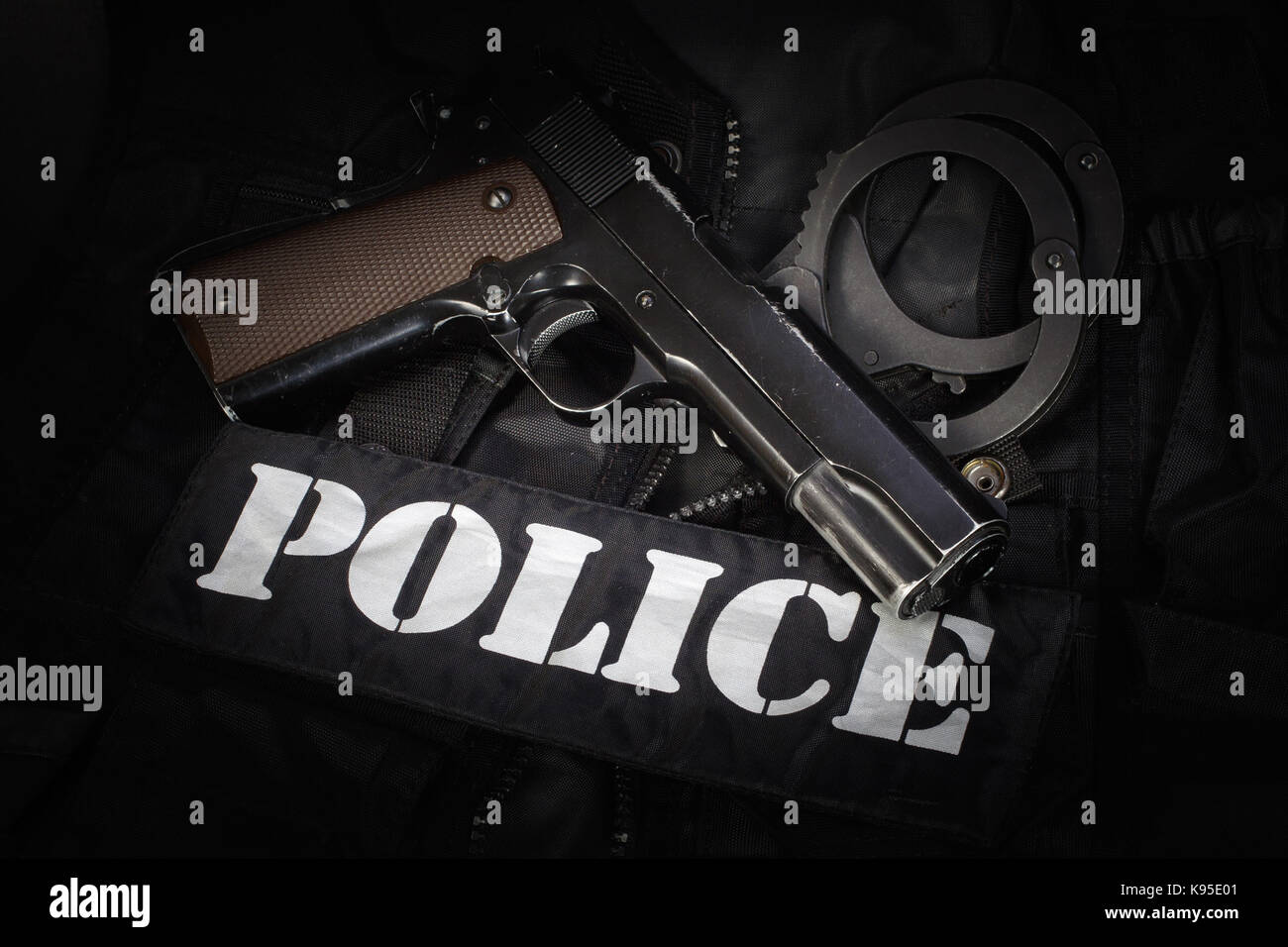 Police equipment on black background Stock Photo - Alamy