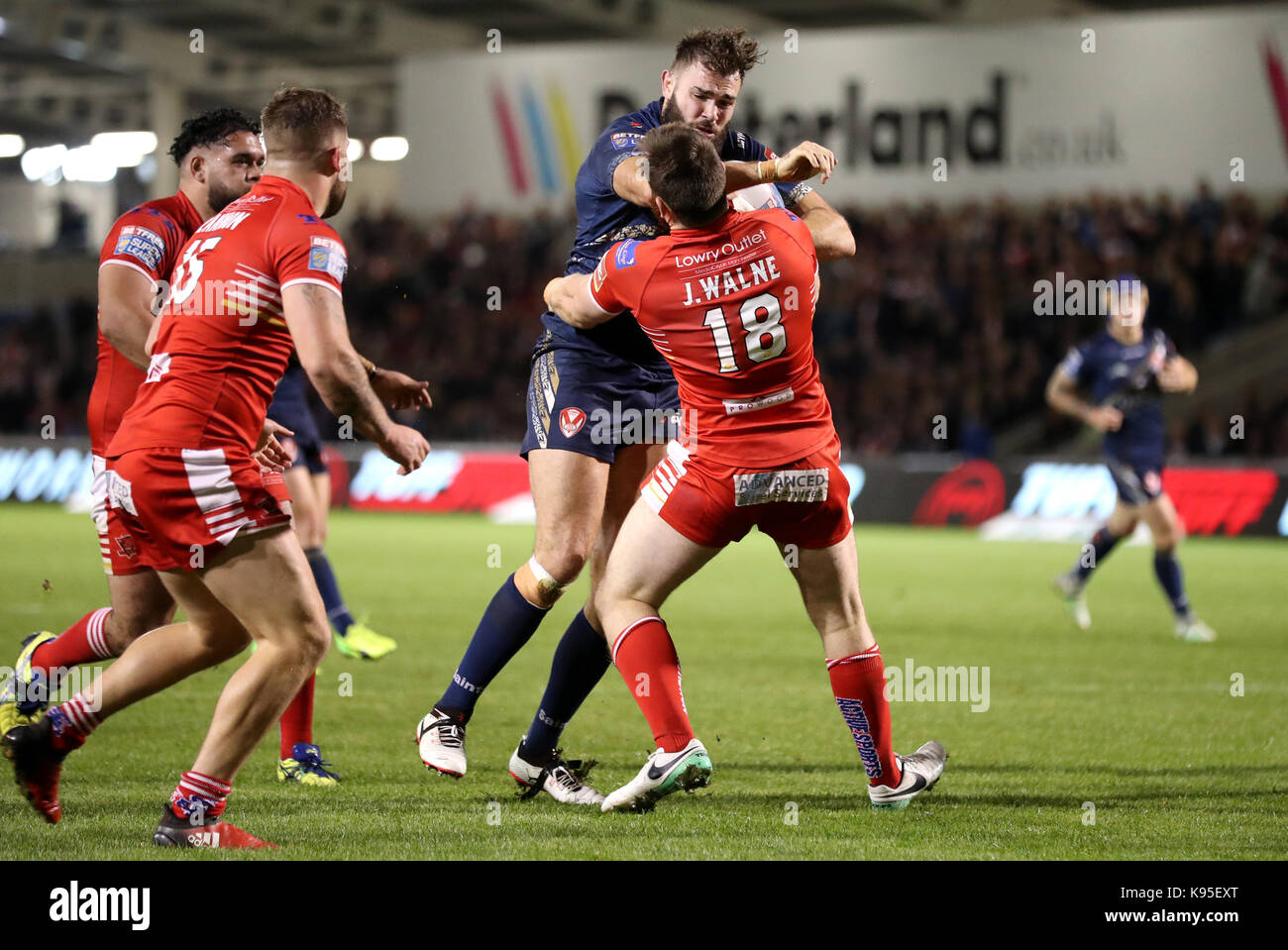 St Helens Alex Walmsley drives to the line past Salford Red Devils' Mason Caton-Brown for a try, during the Betfred Super 8s match at the AJ Bell Stadium, Salford. Stock Photo