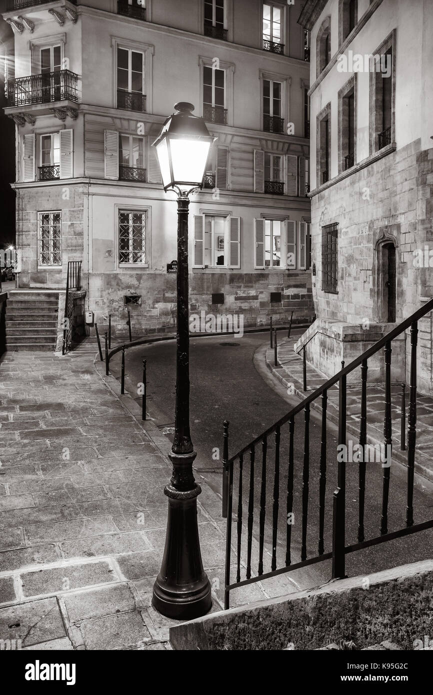 Illuminated Side street in Paris, Ile-de-France, France Stock Photo