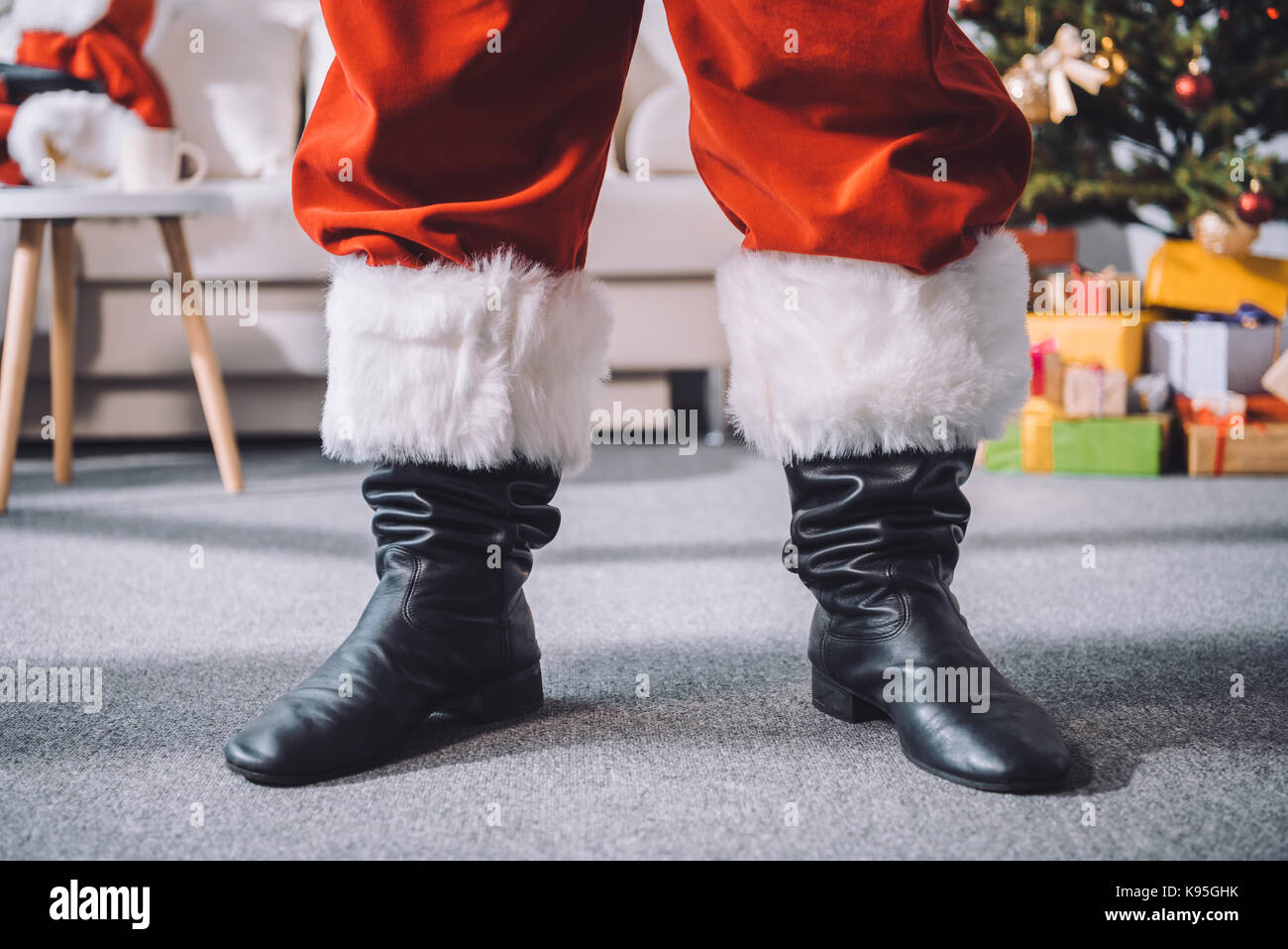 santa claus in black boots Stock Photo - Alamy