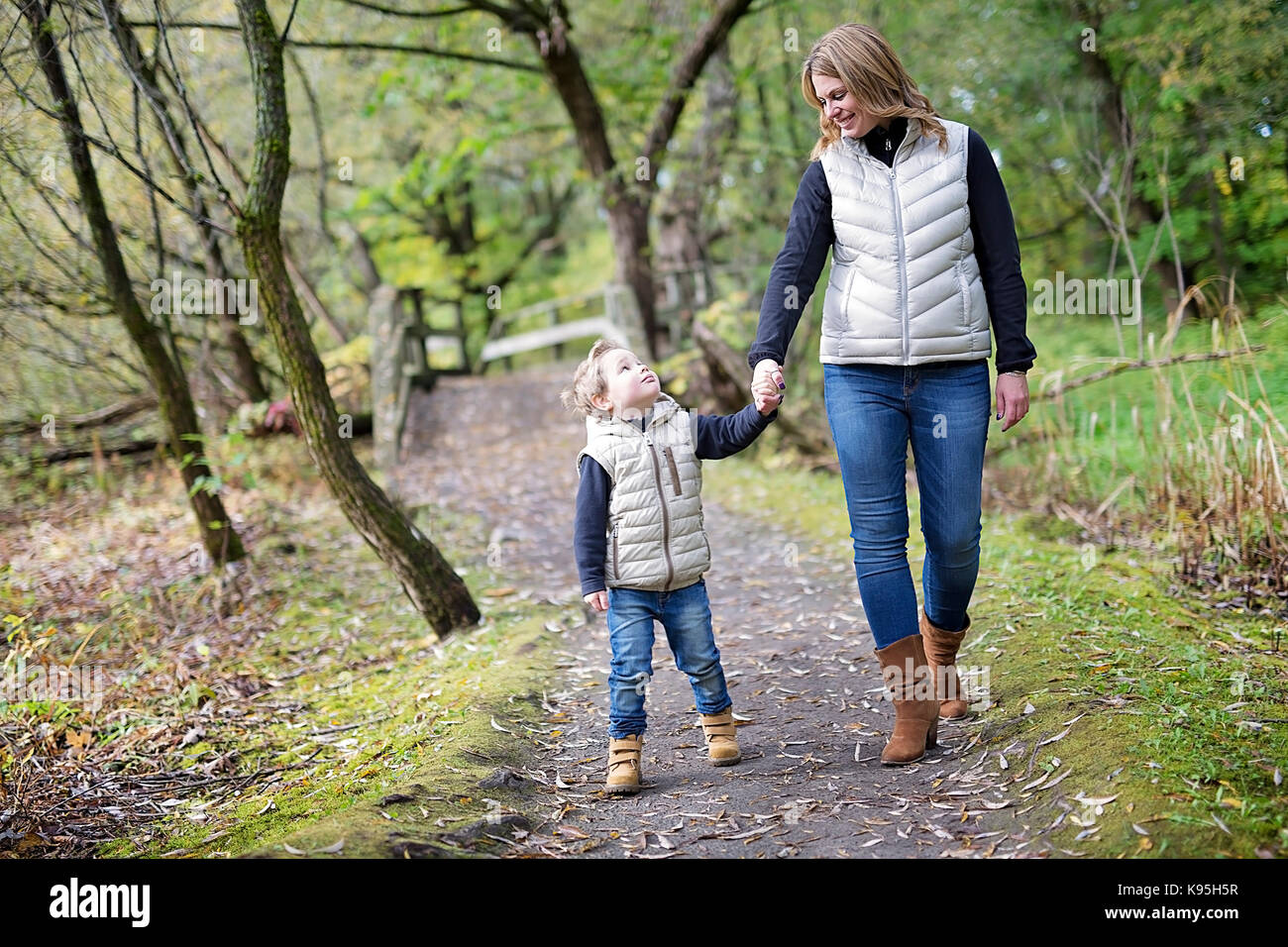 Adorable little boy with his mother in autumn park Stock Photo - Alamy