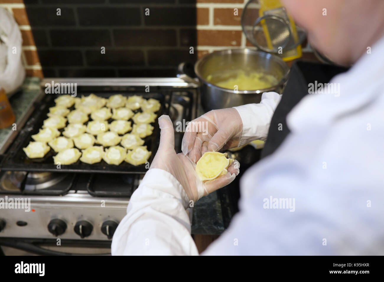 Male chef uses ingredients for preparing flour products on kitch Stock ...
