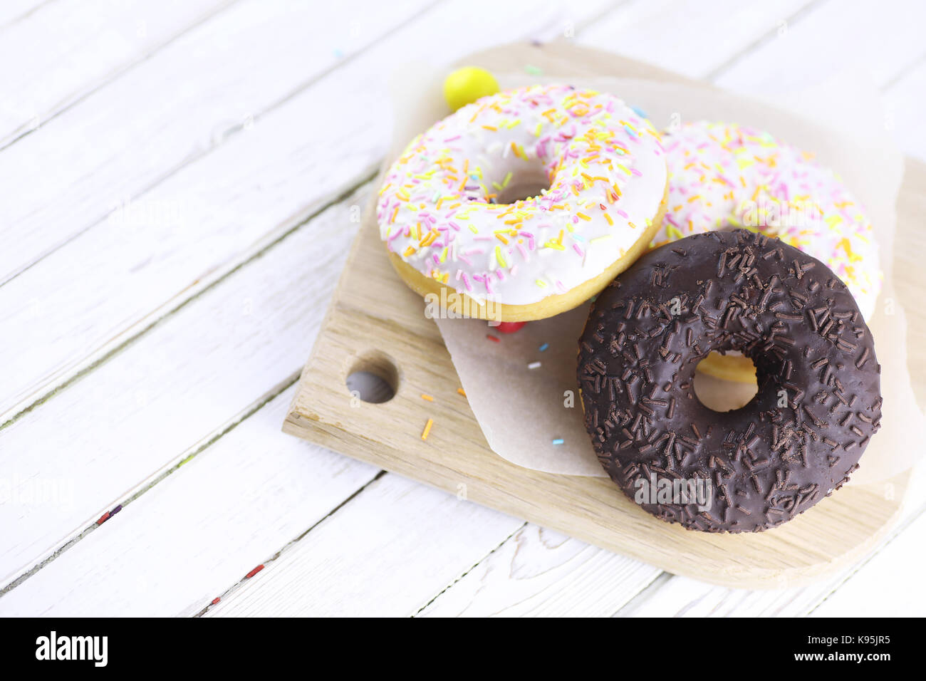 Chocolate Donut on a wooden white background Stock Photo - Alamy