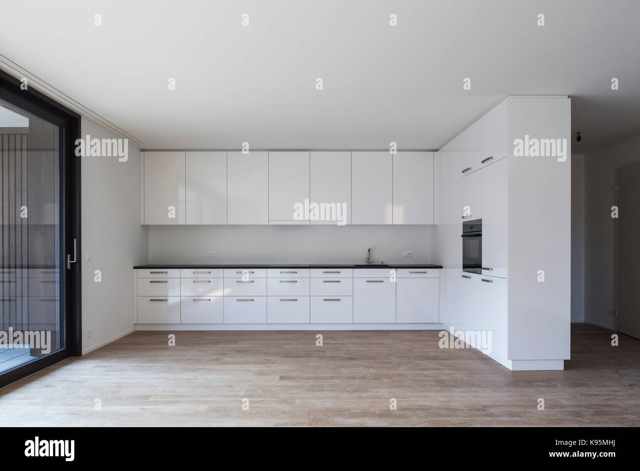 Unfurnished kitchen. Housing estate Malters, Malters, Switzerland. Architect: Diener & Diener, 2016. Stock Photo