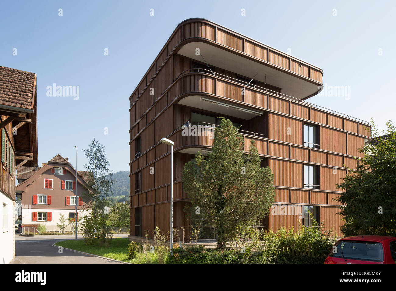 Oblique elevation with context. Housing estate Malters, Malters, Switzerland. Architect: Diener & Diener, 2016. Stock Photo