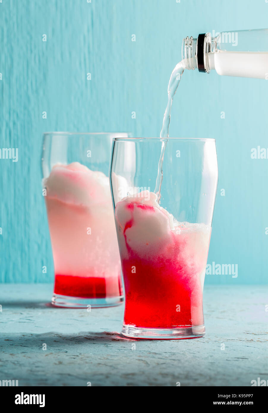 Preparation of cocktail Terremoto. Chilean traditional alcoholic drink Terrremoto. with pineapple ice cream, liquor grenadine, pisco and white wine. B Stock Photo