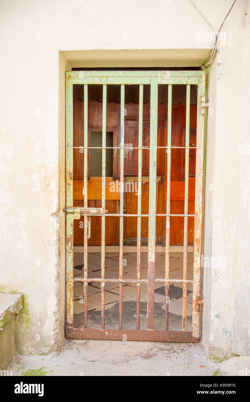 QUITO, ECUADOR NOVEMBER 23, 2016 Indoor view with a door with bars