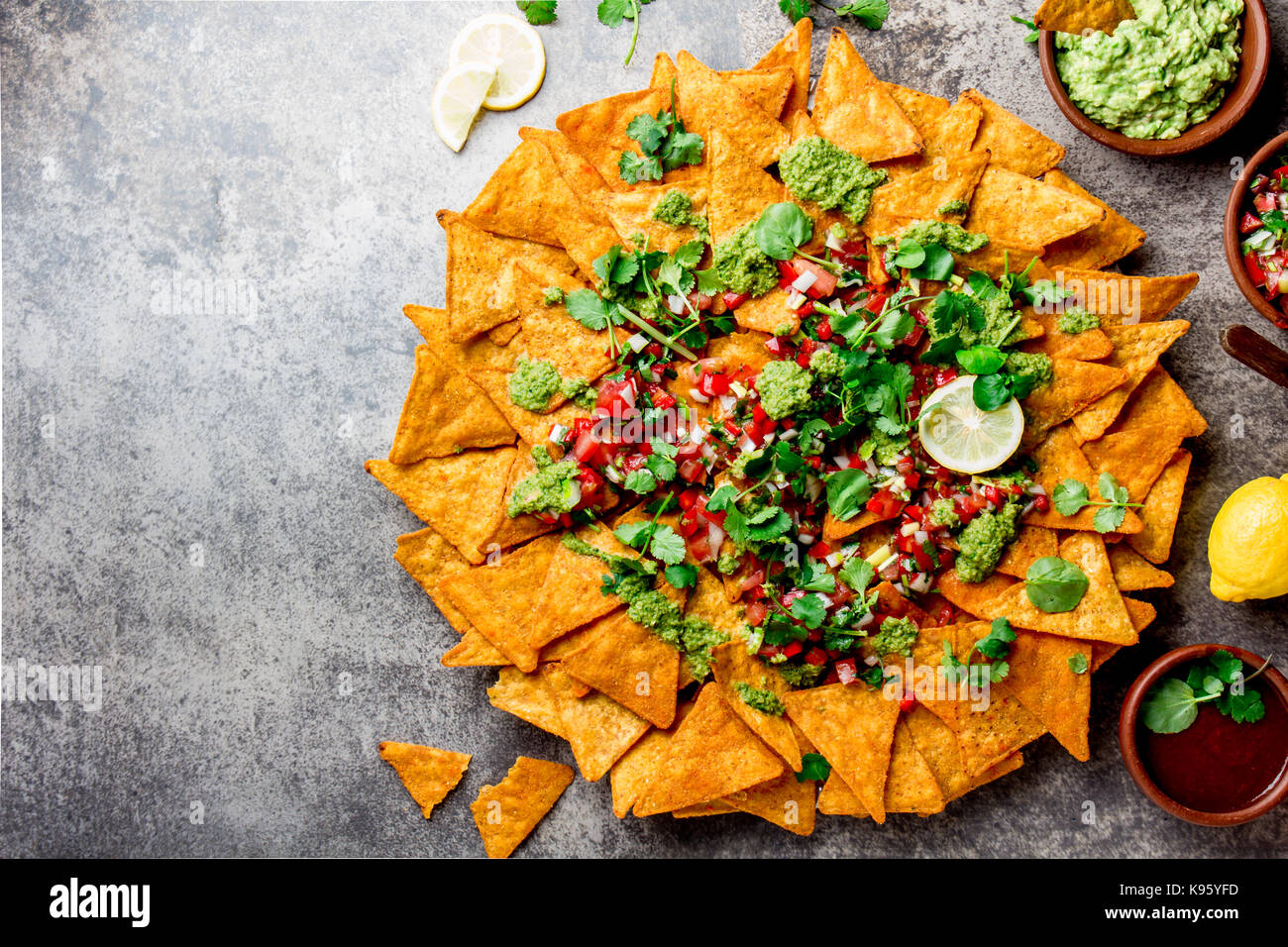 Nachos. Totopos with sauces. Mexican food concept. Yellow corn totopos