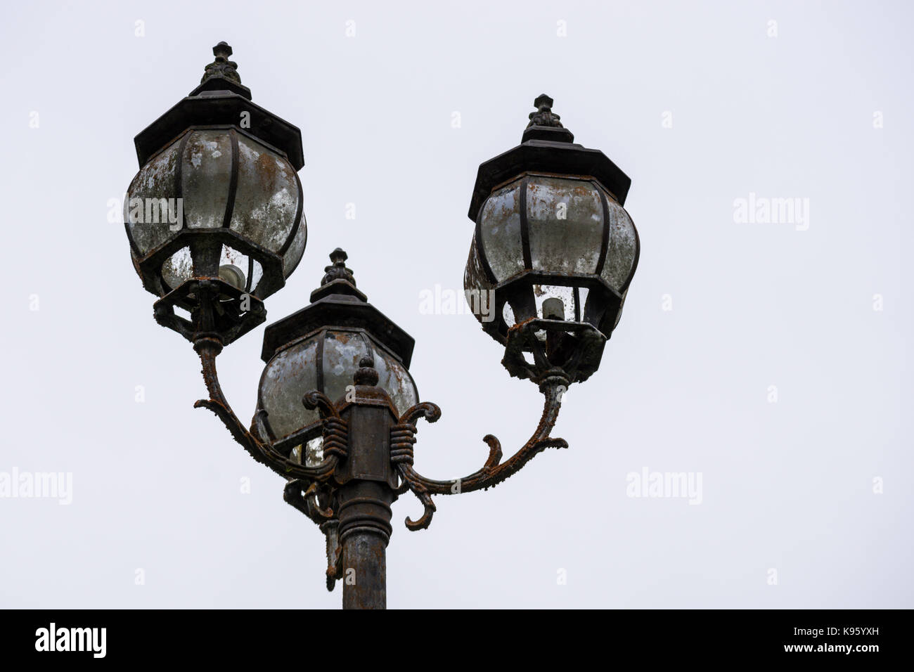 Old street lights half broken and rosty color and black and white Stock Photo