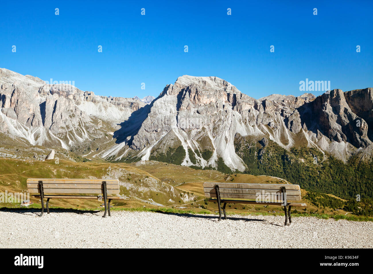 Mountain view of Dolomite Alps with empty benches in the foreground Stock Photo