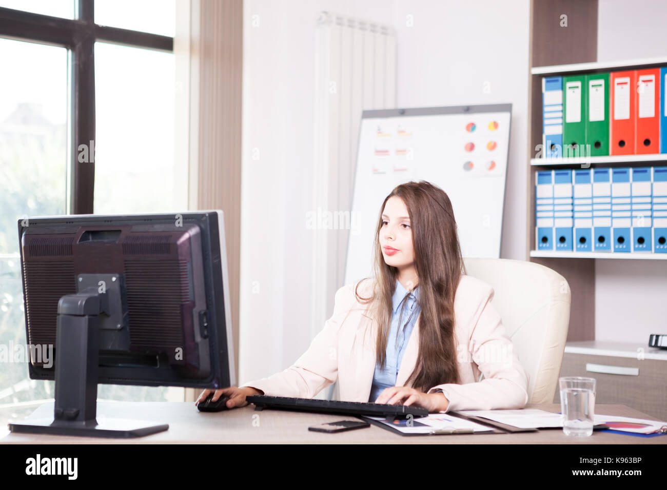 Young professional businesswoman working in the office Stock Photo - Alamy