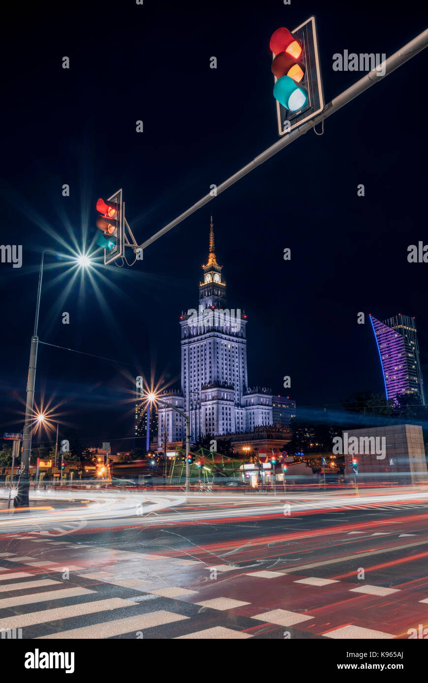 Palace of Culture and Science in Warsaw. In foreground busy street at night. Long exposure photo Stock Photo