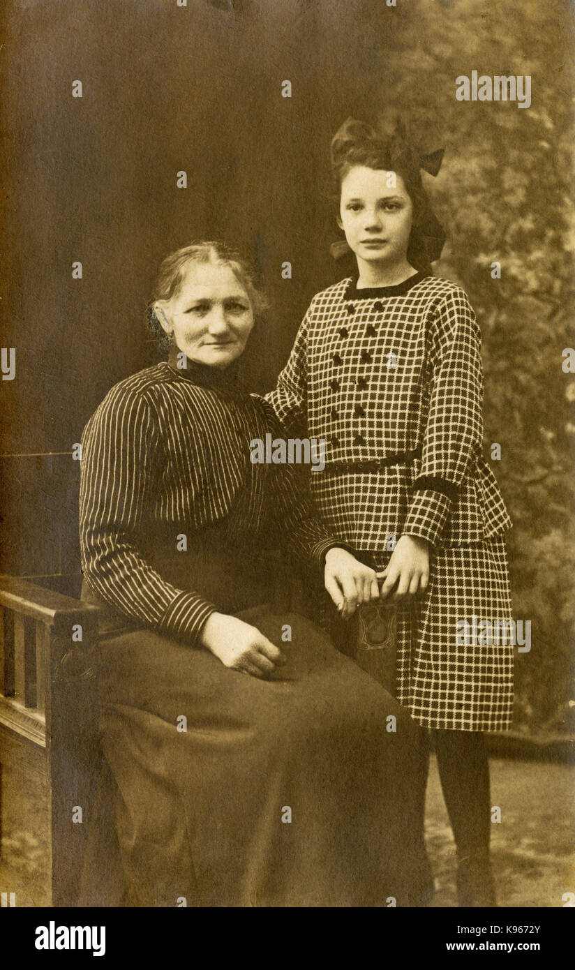 Antique c1920 photograph, grandmother and granddaughter studio image. SOURCE: ORIGINAL PHOTOGRAPH. Stock Photo