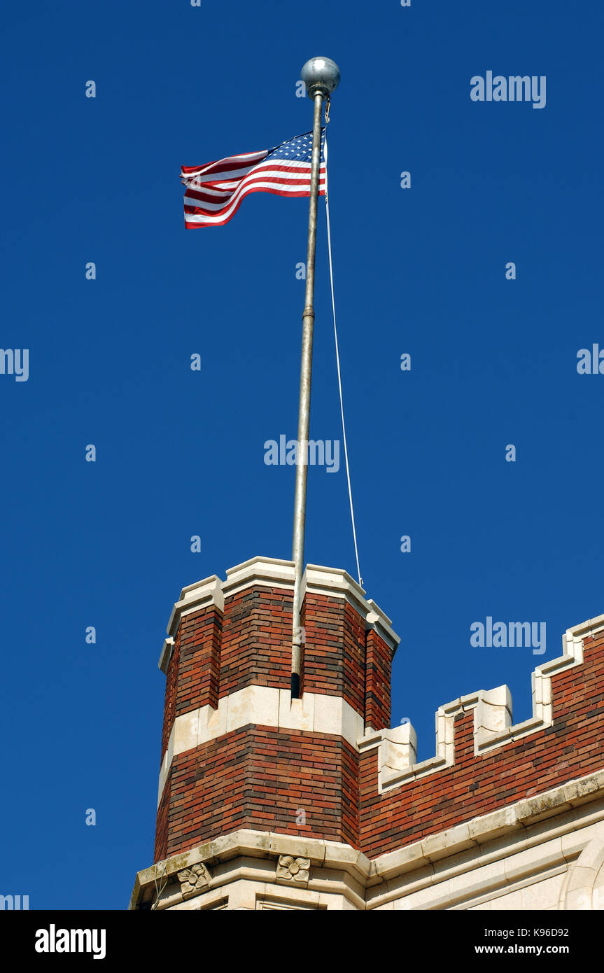 Vivid blue skies frame American flag flying over the old Hot Springs ...