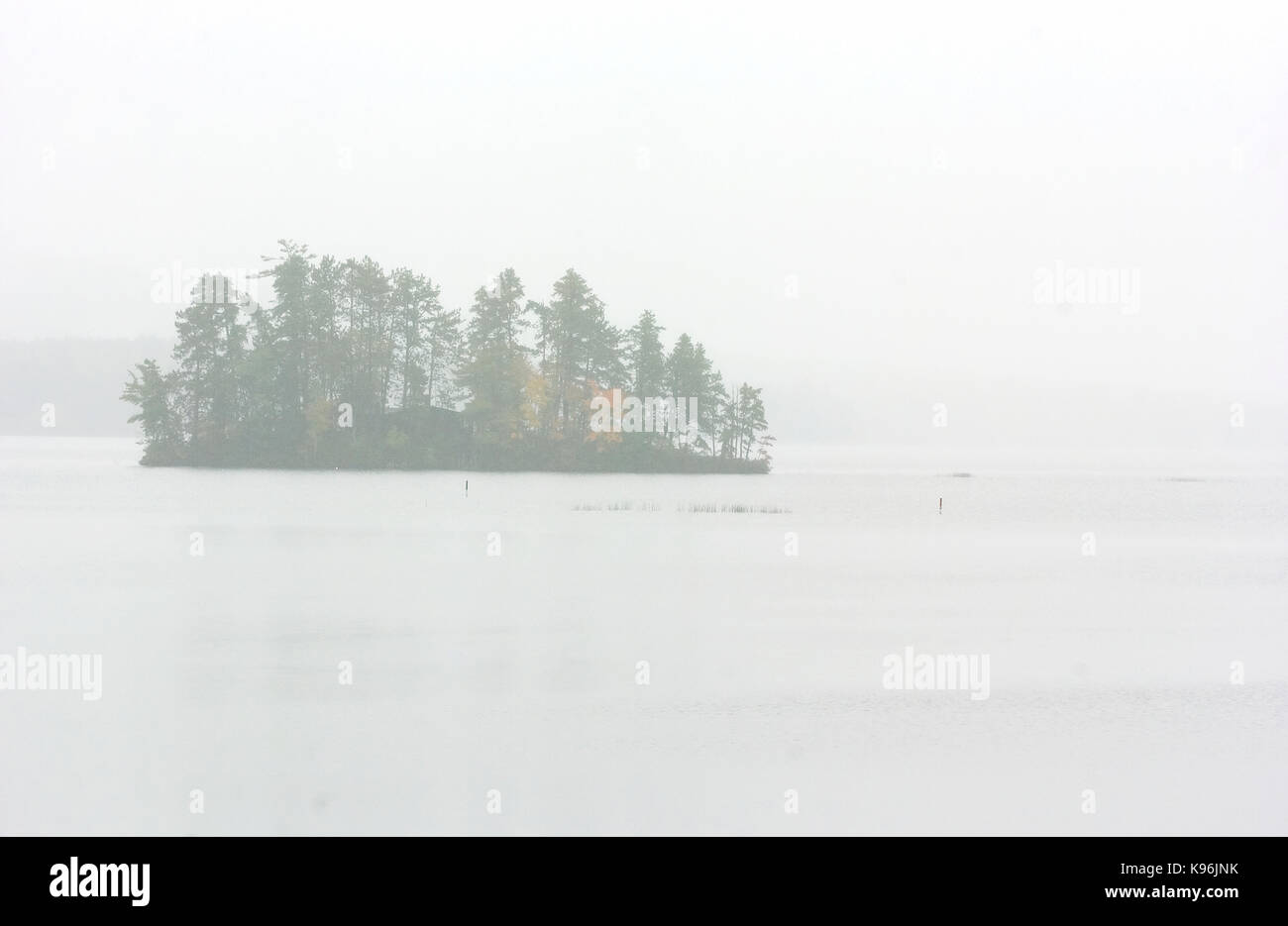 Island in the Fog.   Silver Lake - Madison, NH Stock Photo