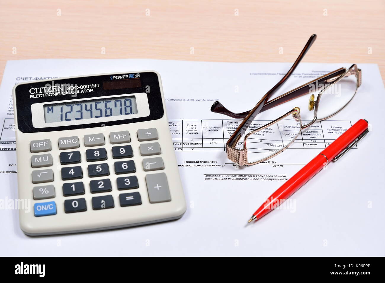 White calculator, red pen with goggles and invoice are on the table  accountant. Business still life Stock Photo - Alamy