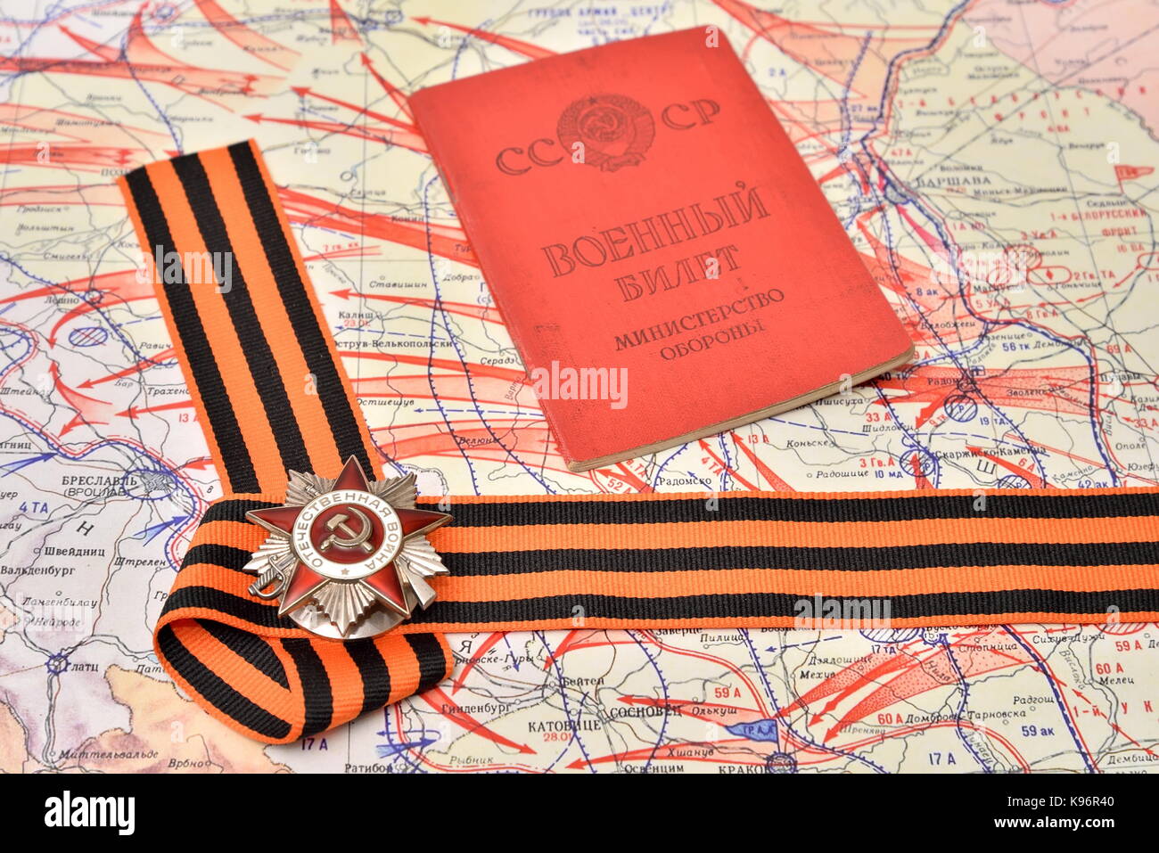 ST.PETERSBURG, RUSSIA - APRIL 27, 2017: Order of the Patriotic War in St. George ribbon and the Soviet military ID are on the military map of the offe Stock Photo