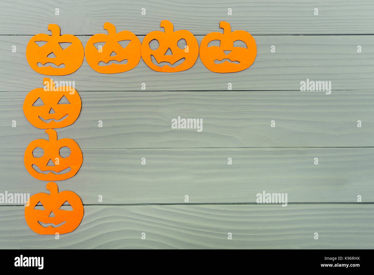 Corner frame on the left side with different pumpkin paper silhouettes ...