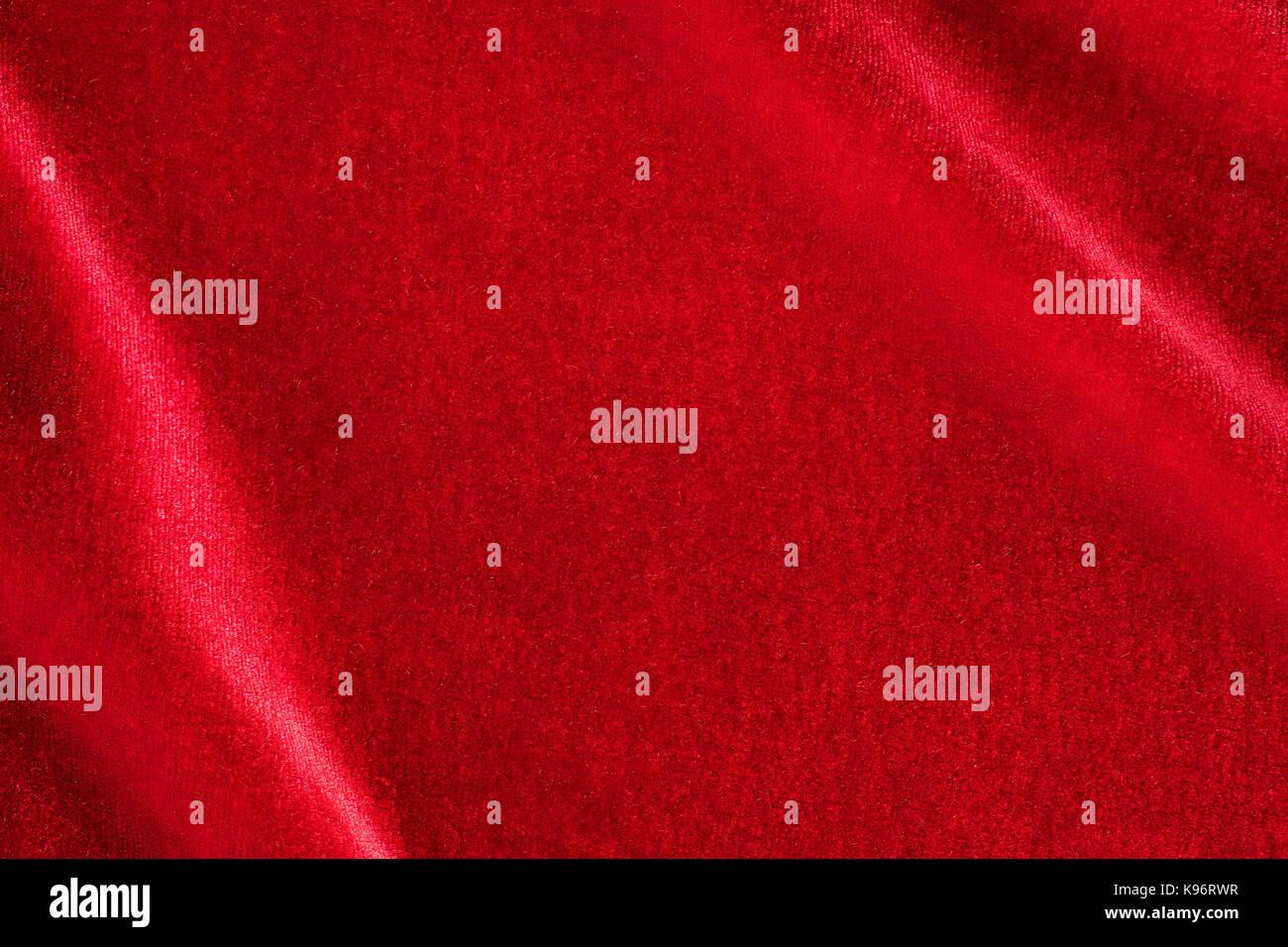 Red silk velvet close up with copy space. Background and texture Stock Photo