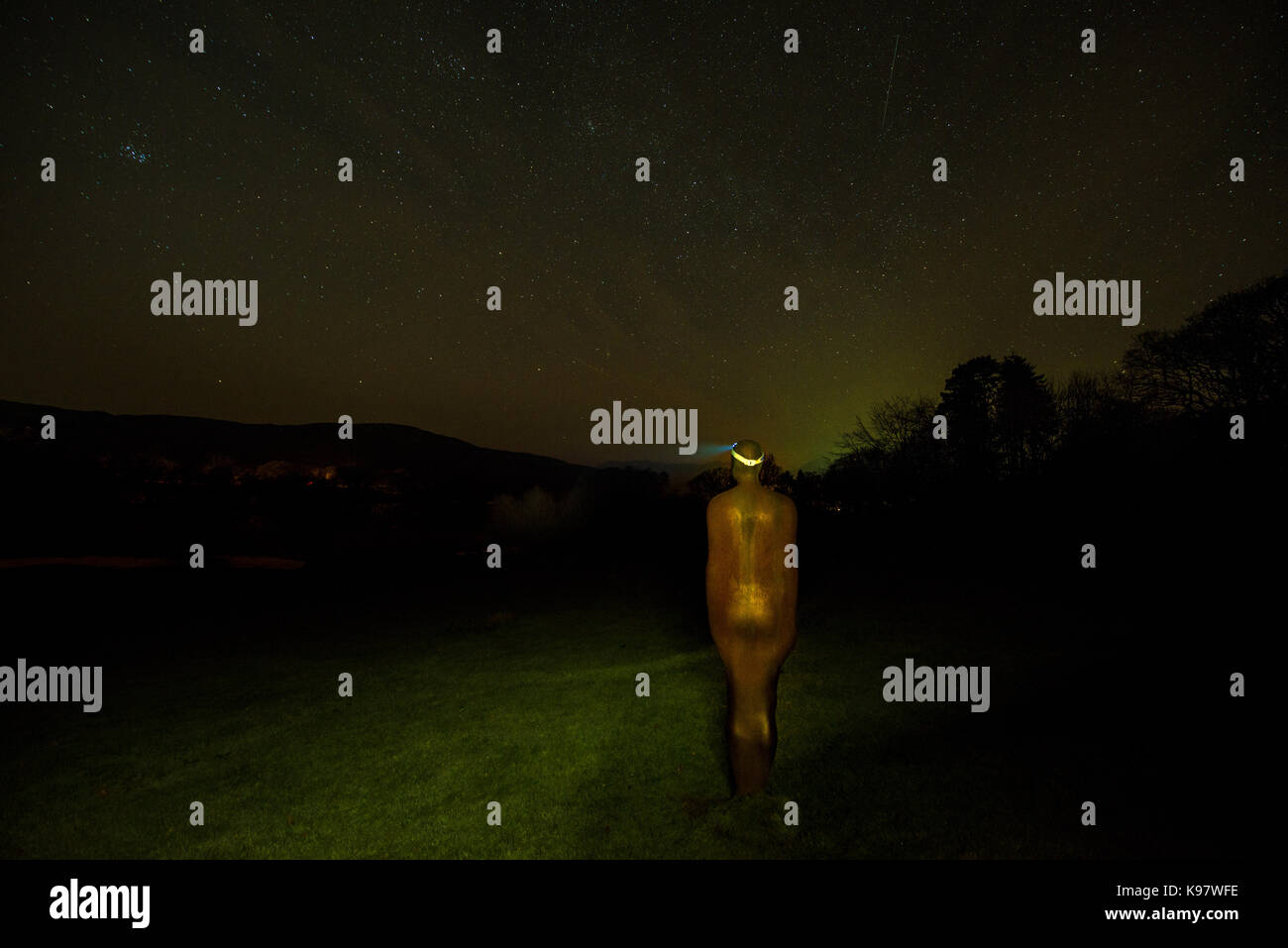Anthony Gormley stole my headtorch whilst out aurora hunting tonight.  I think he was scared of the badger that was taking unnerving interest in me!   Stock Photo