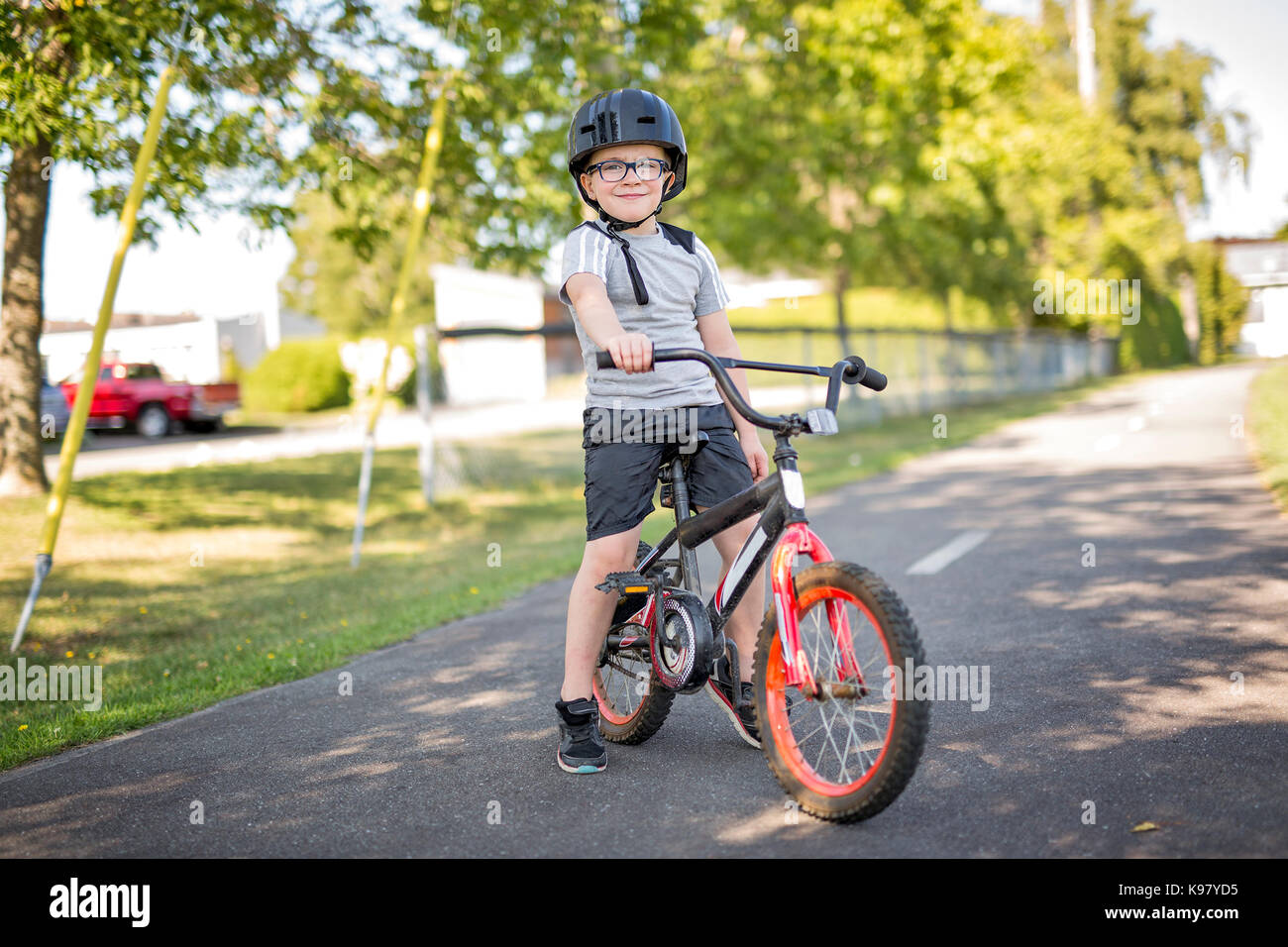 Six year old boy riding bike hi res stock photography and images