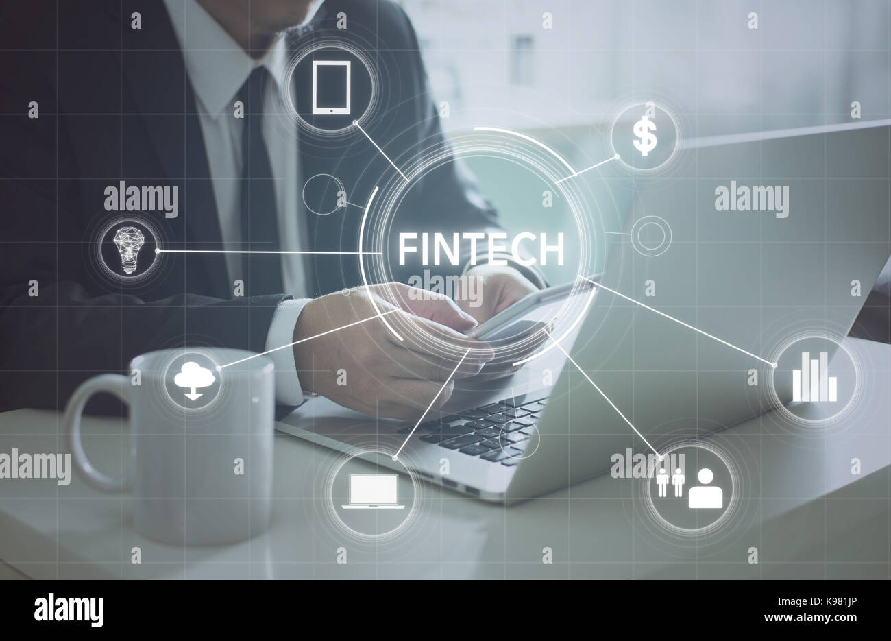 Businessman with fintech icon and internet of things with matrix code background , Investment and financial internet technology concept. Stock Photo