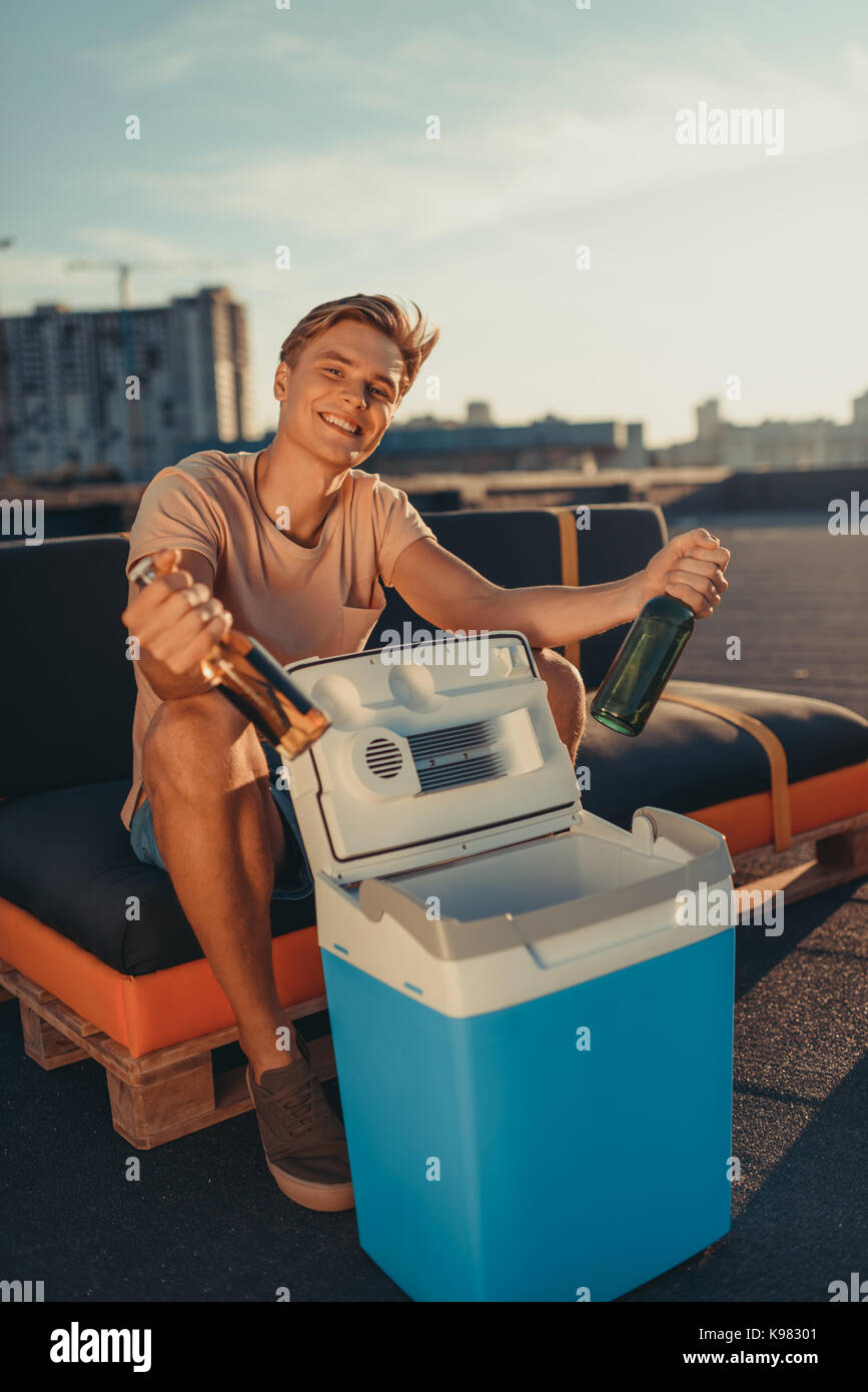 man taking out beer from fridge Stock Photo Alamy