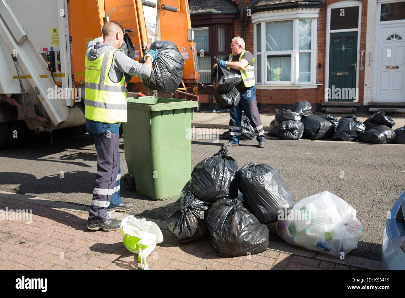 Piles of rubbish in Medley Road, Tyseley, Birmingham during the bin men's strike. Stock Photo