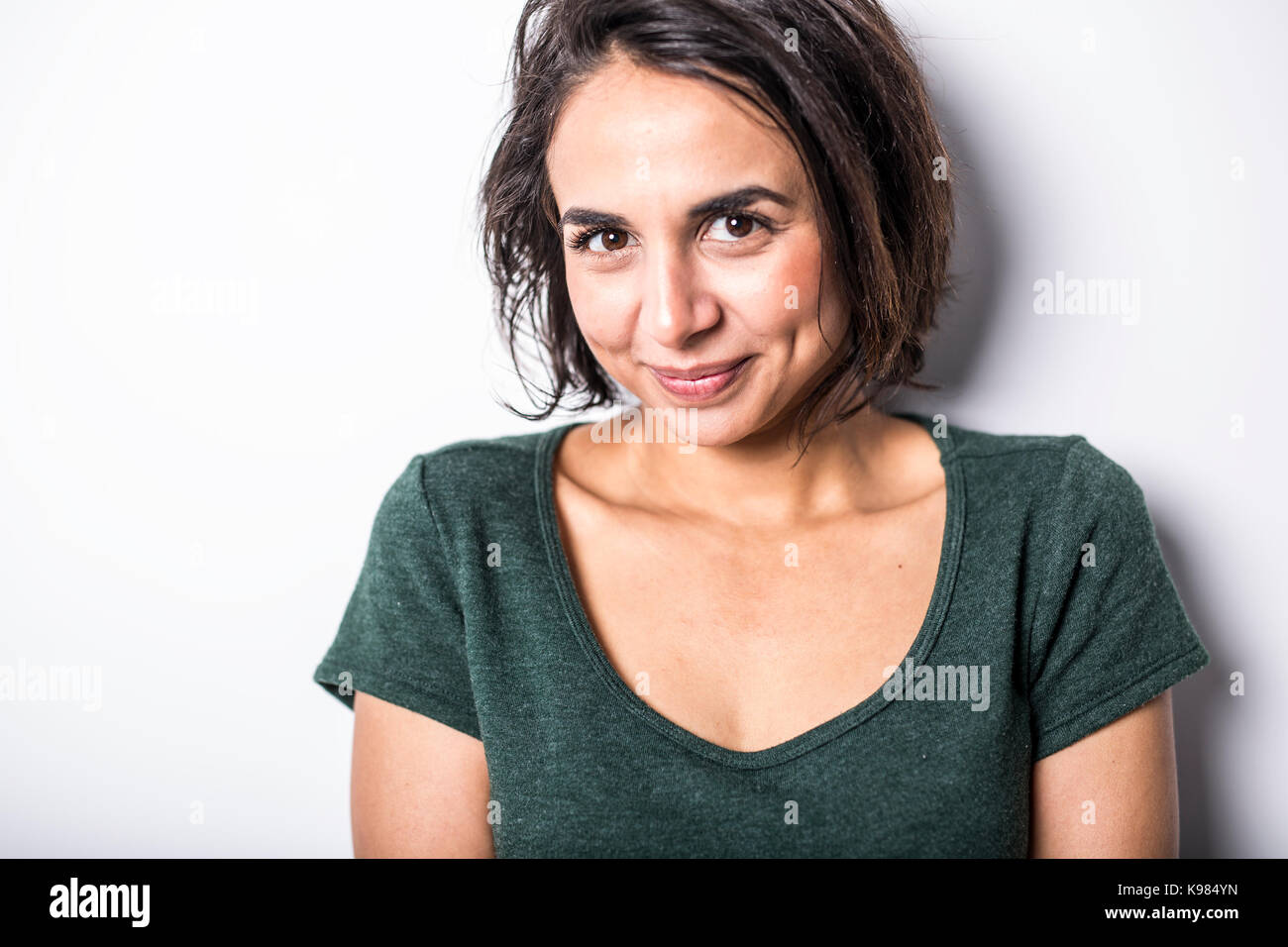 A bright brunette girl isolated on a white background Stock Photo - Alamy