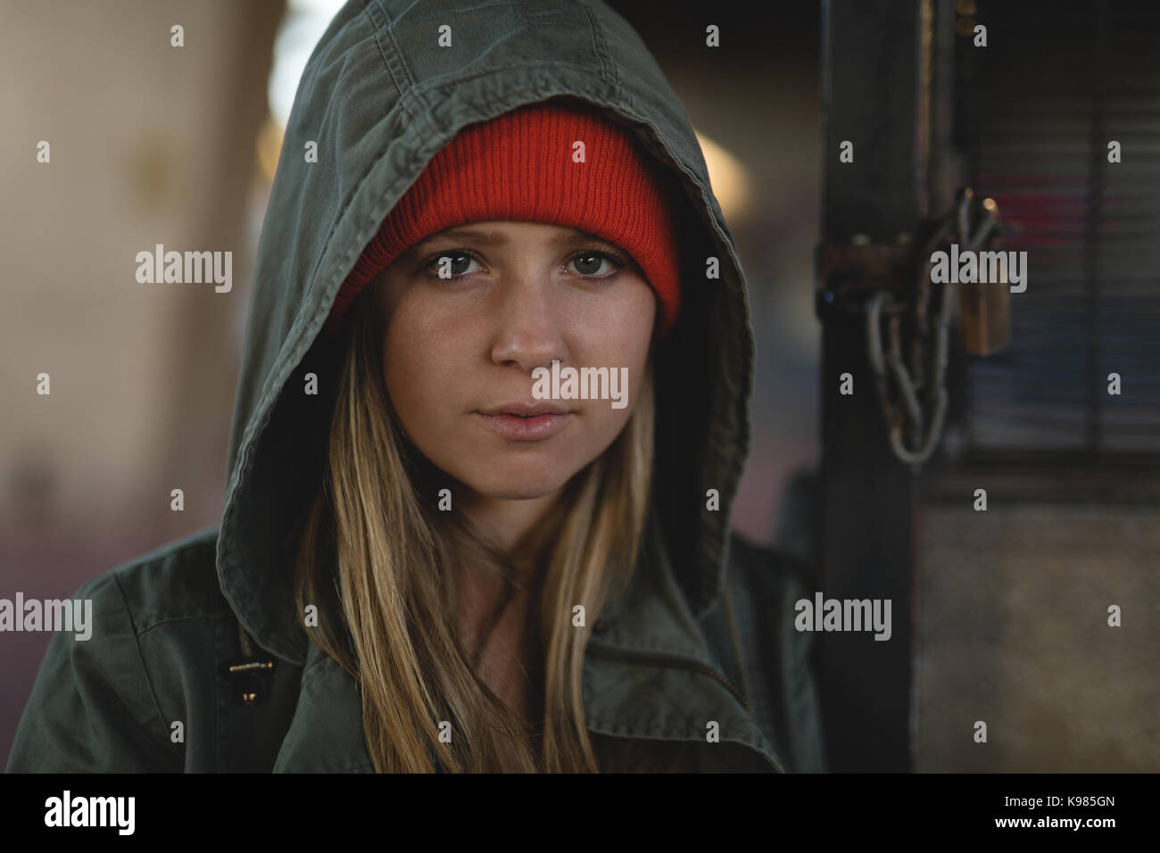 Close-up portrait of young woman in hooded jacket Stock Photo