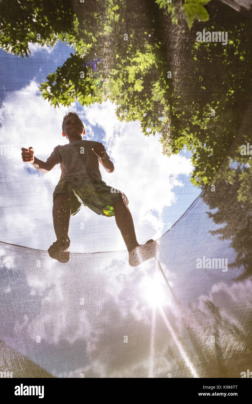 Boy playing on playground equipment hi-res stock photography and images ...