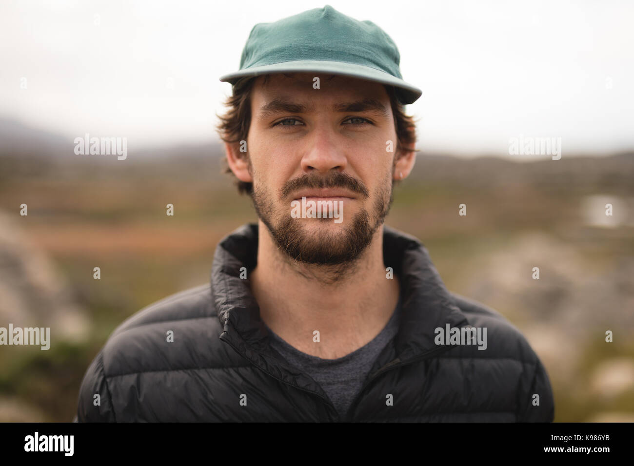 Close-up of confident man wearing cap Stock Photo - Alamy