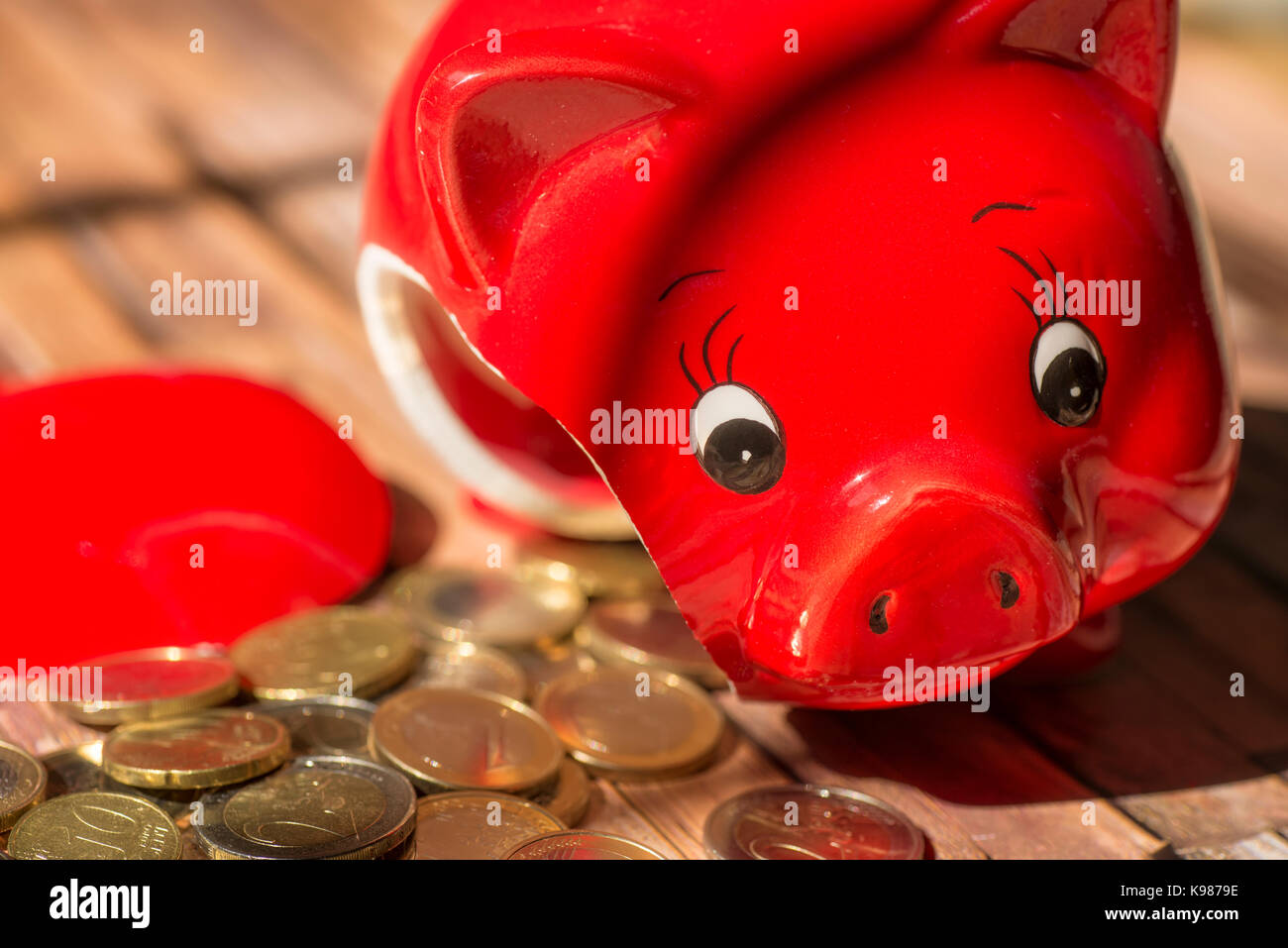 Broken piggy bank with many coins Stock Photo Alamy